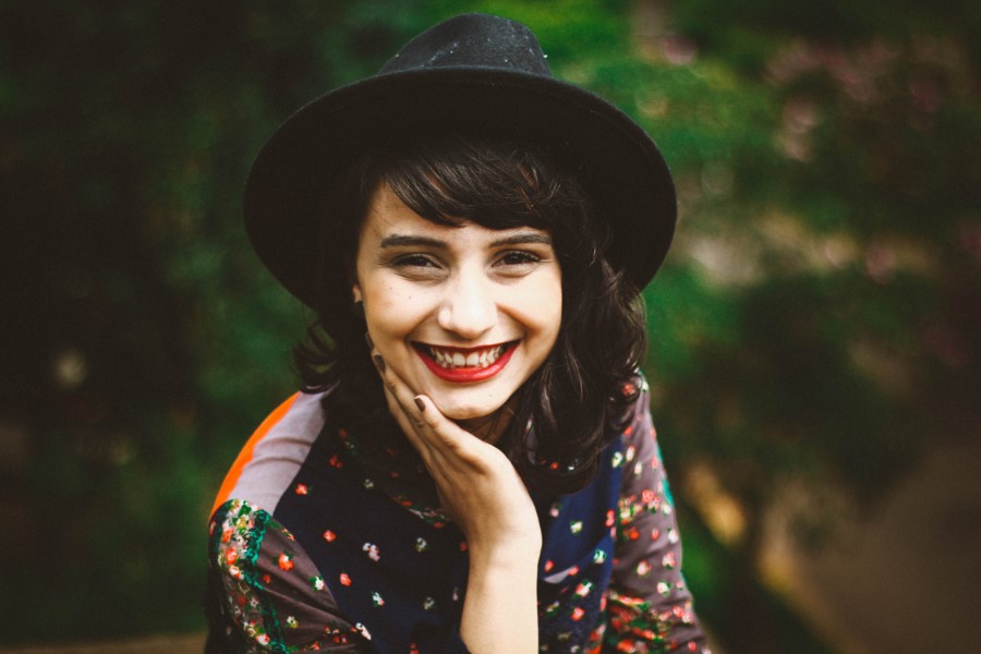 Smiling girl with a hat